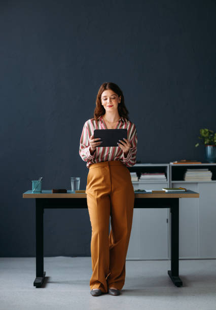 istock Professional Businesswoman Using Digital Tablet in Modern Office 2035915116