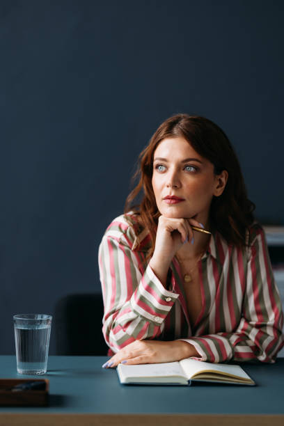 istock Thoughtful Professional Woman Brainstorming Ideas at Work 2035915627