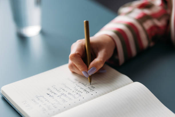 istock Focused Woman Writing in Notebook, Creative Planning and Ideas 2035915634