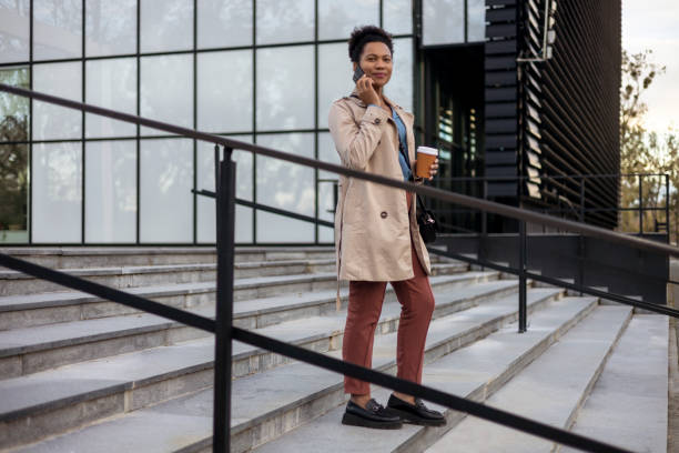 Black Female Entrepreneur Talking on Smart Phone Outdoors