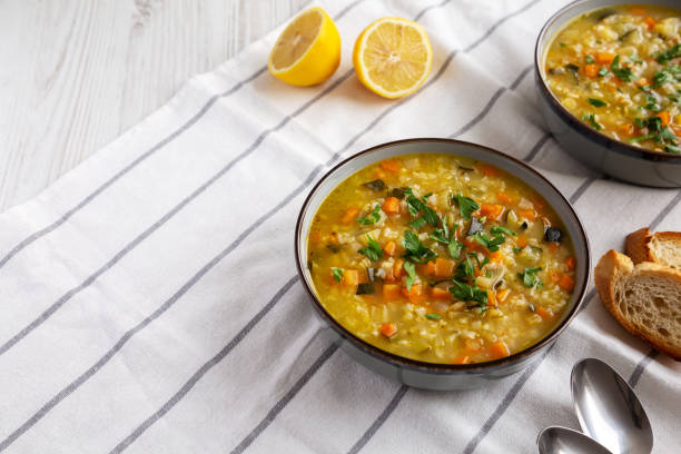 istock Homemade fresh lemon rice soup in a bowl, side view. Copy space. 2035967530