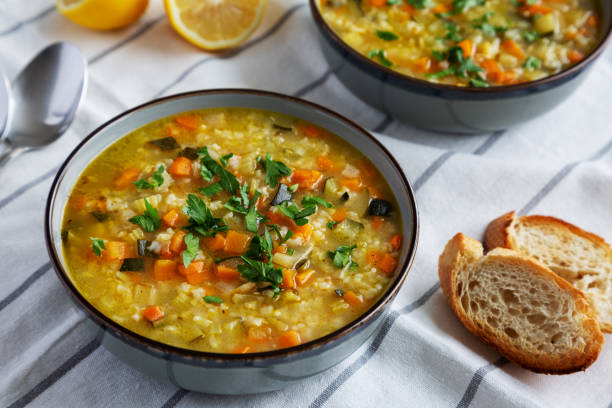 istock Homemade fresh lemon rice soup in a bowl, side view. Close-up. 2035967546