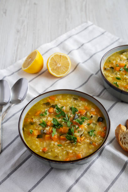 istock Homemade fresh lemon rice soup in a bowl, side view. Close-up. 2035967558