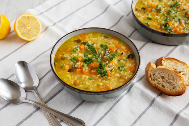 istock Homemade fresh lemon rice soup in a bowl, side view. 2035968090