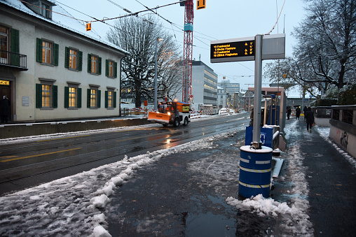 Zurich Enge district with a city street during a winter day. The image was captured at dusk.