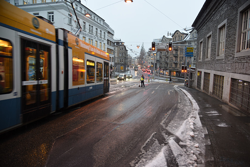 Zurich Enge district with a city street during a winter day. The image was captured at dusk.