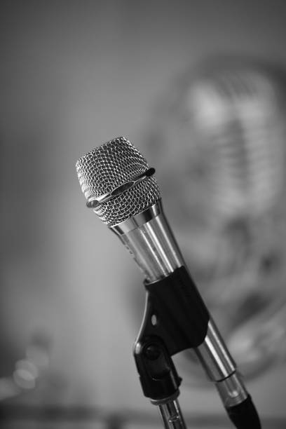 Black and white photo. Podcast audio vocal mic