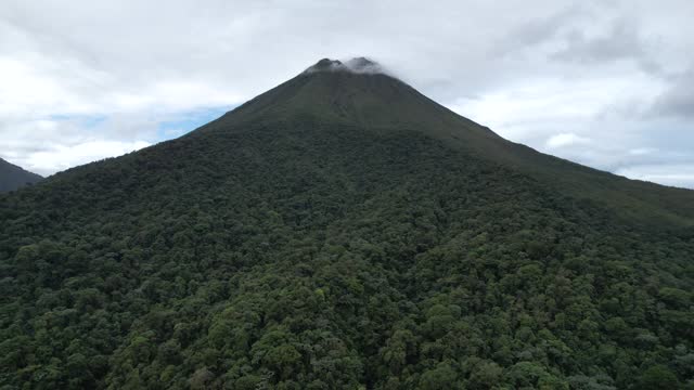 Beautiful cinematic view of the Arenal volcano and the Lagoon in Costa Rica