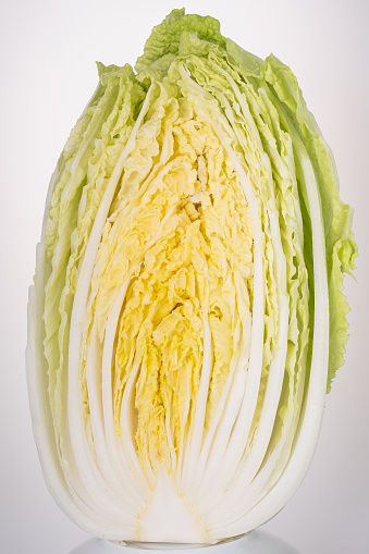 sliced Chinese cabbage on white background.