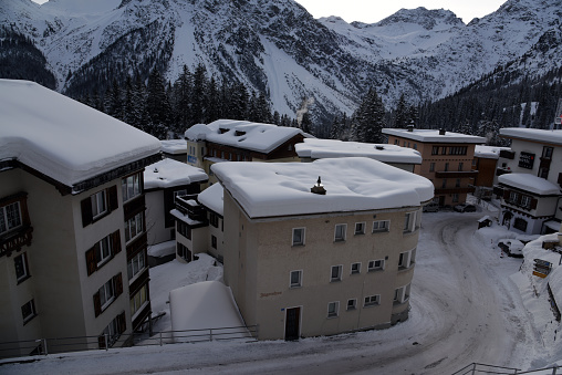 Arosa, the alpine winter resort with several residential buildings captured during winter season.