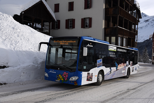 Arosa (swiss ski resort) with a public bus. Captured during winter season.