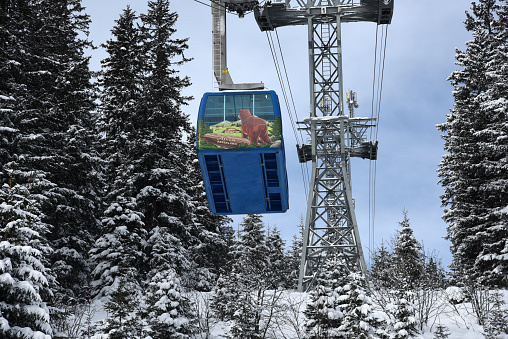Arosa with a huge cable car for transporting the ski and snowboard tourists to the peaks. Captured during winter season.