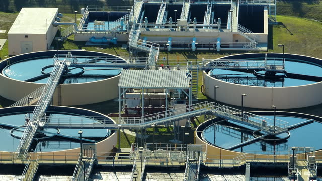 Aerial view of water treatment factory at city wastewater cleaning facility. Purification process of removing undesirable chemicals, suspended solids and gases from contaminated liquid