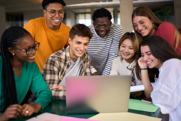istock Concentrated young group of university student using laptop in the cafeteria on campus 2036297058