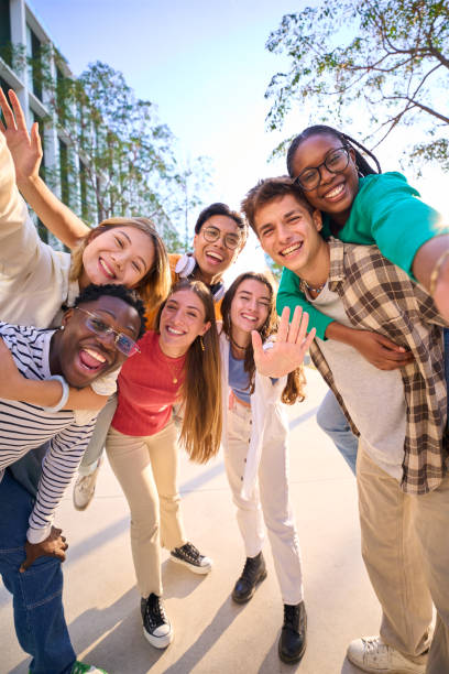 istock A large multiracial group of teenagers taking a selfie looking front camera laughing 2036308003