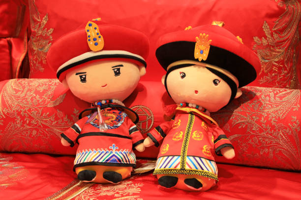 Traditional Chinese style dolls are on the bed
