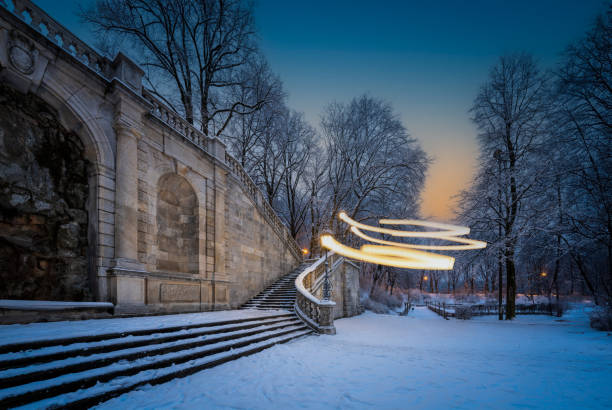 there are light beams which look fancy and mystic in a cold winter parc