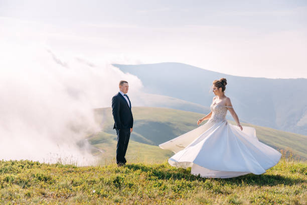 istock the cheerful bride is dancing, spinning against the background o 2036403853