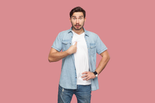 istock man points at herself and cannot believe being chosen keeps mouth opened from wonder. 2036414048