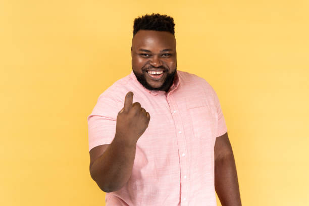 istock Man making beckoning gesture, inviting for date and looking alluring, flirting to camera. 2036415181