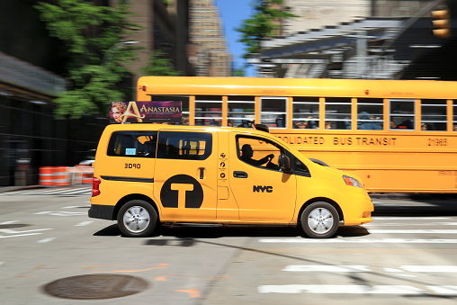 Tipycal yellow New York taxi. Long exposure photo