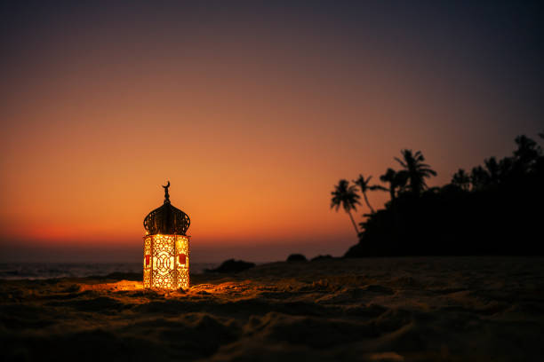 istock New Eid Mubarak background design, Ramadan Lantern Lamp with sunset sky, Islamic concept image 2036476563