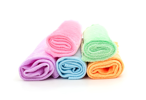 Colorful kitchen towels isolated on a white background.