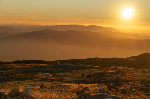 Beautiful golden sunset seen from Torre mountain peak of Serra da Estrela, Portugal