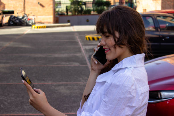 istock Beautiful young woman doing remote work outside 2036640195