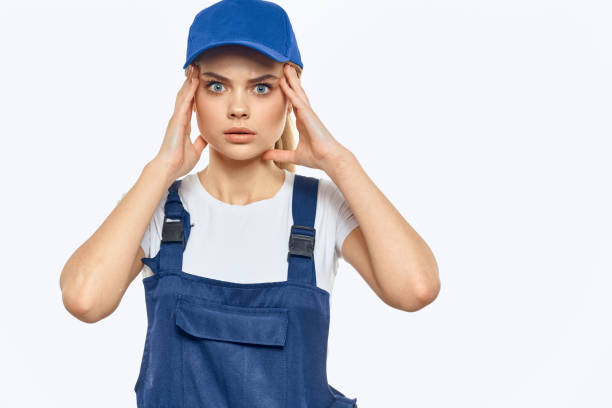 istock Woman in working uniform blue cap delivery courier delivery service 2036685477