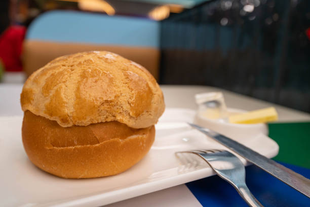 Close-up view of a pineapple bun with butter.