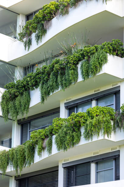 Closeup new, modern apartment building with vertical gardens, Cronulla Australia, background with copy space, full frame vertical composition