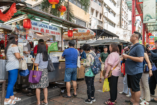 Kuala Lumpur, Malaysia : February 4,2024 : Famous Kim Soya Bean at Kuala Lumpur Petaling Street, people can seen queuing to buy soya bean or tau fu fah in front of the Kim Soya Bean stall.