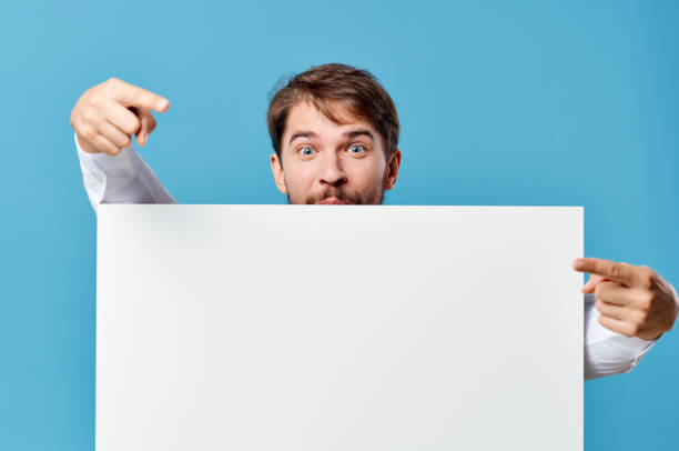 istock man in shirt with tie white mockup advertisement presentation blue background Copy Space 2036847322