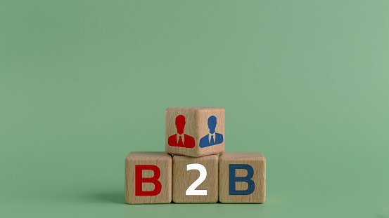 Concept of B2B with icons on wooden cubes