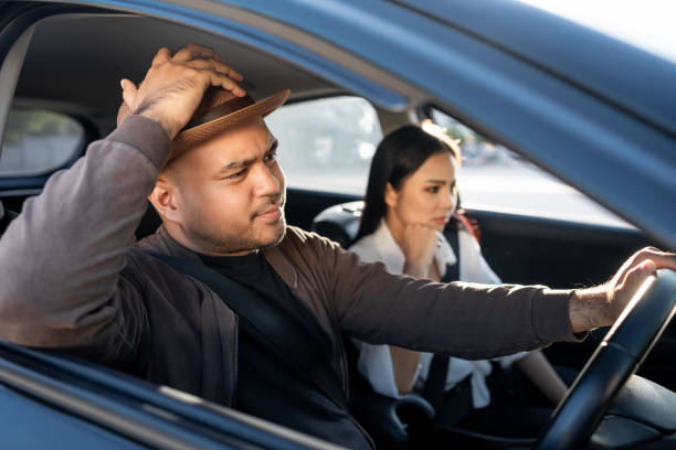 young asian couple man and woman quarrel in car angry face. relationships problems conflicts in marriage. driving during rush hour  traffic feeling serious and stressed argument fighting shouting - accident taxi driving tourist zdjęcia i obrazy z banku zdjęć