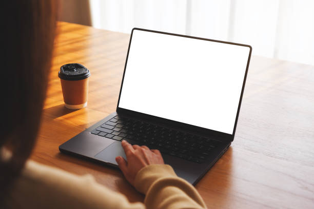istock Mockup image of a woman working and typing on laptop computer with blank white desktop screen at home 2036893251