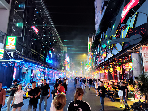Crowd of people walking in Bui Vien Street, the main nightlife street of Pham Ngu Lao, the so called ‘backpackers area’ of Ho Chi Minh City, Vietnam