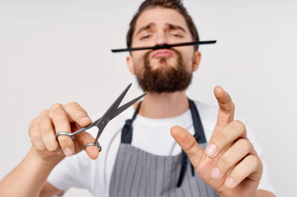 istock barbershop model man gray apron beard hairstyle 2036961634