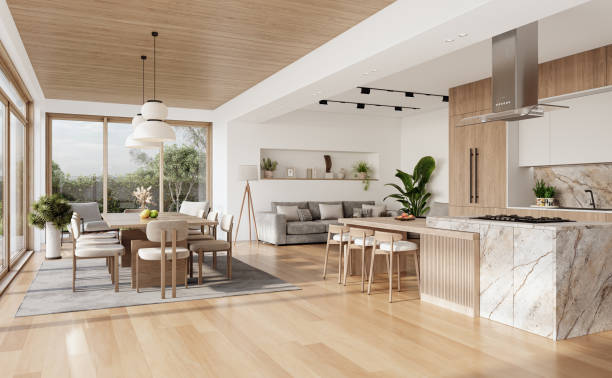 istock Open space living room and kitchen interior with large windows, gray sofa, dining table and hardwood flooring. Modern design solution 2037012331