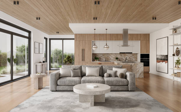 istock Open space living room and kitchen interior with large windows, gray sofa, dining table and hardwood flooring. Modern design solution 2037012398