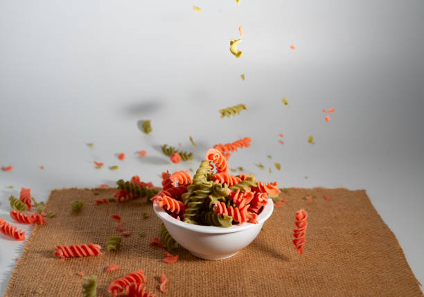 levitaite spiral multicolor spaghetti on bowl and sackcloth