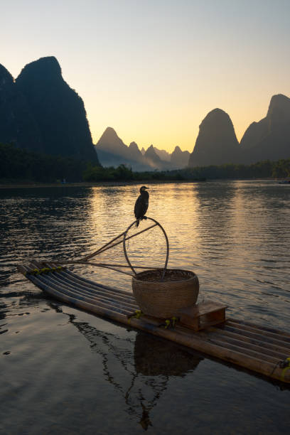 Karst mountains and Li River with bamboo rafts moored on the river