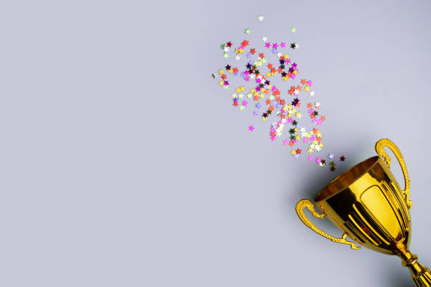 istock Victory cup, confetti celebration, champion's achievement, successful competition 2037157113