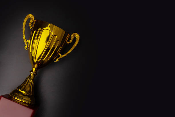 istock Award cup, black background, winning celebration, champion's triumph 2037157114
