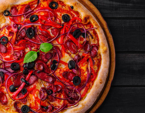istock Pizza with Bavarian sausages with bell pepper and red onion 2037178261