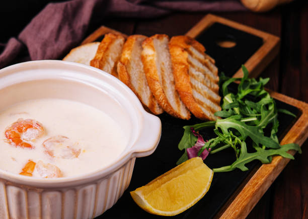 Tasty cream soup with shrimp in bowl