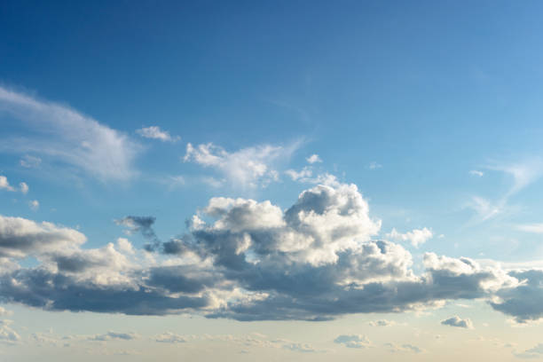 Calm and peaceful sky at sunset with beautiful cumulus clouds