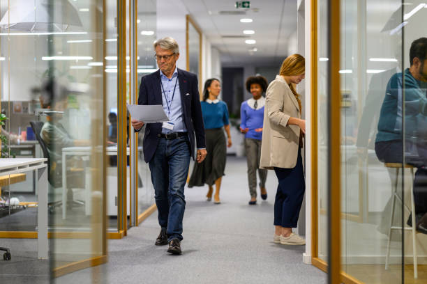 istock Businessman walking in office 2037212300