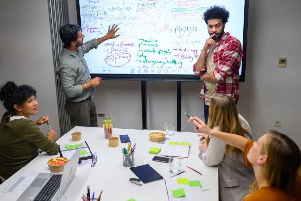 istock Business peoples sitting in boardroom 2037212304
